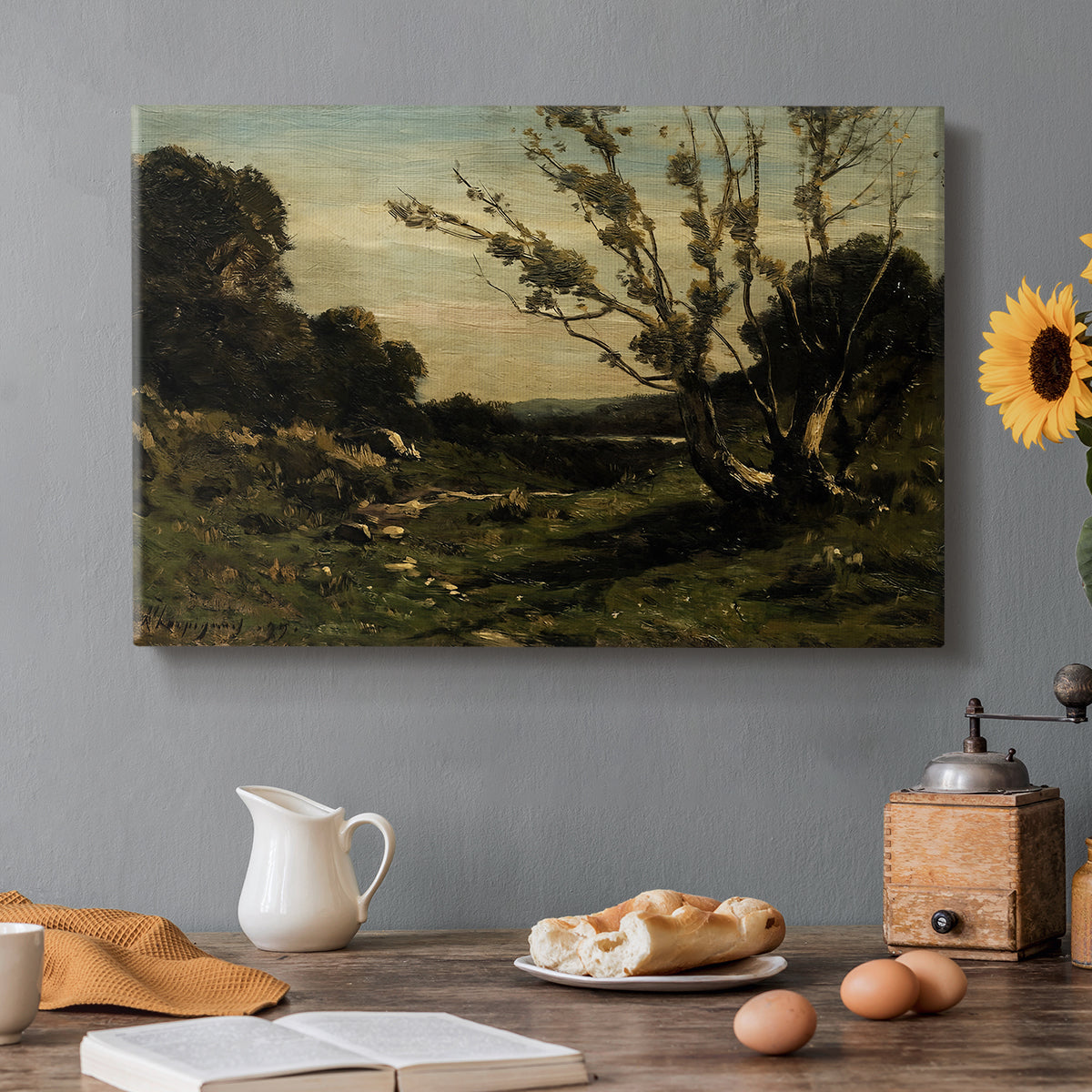 Canvas art print featuring an early morning landscape with trees and soft light over countryside, set in a cozy kitchen setting