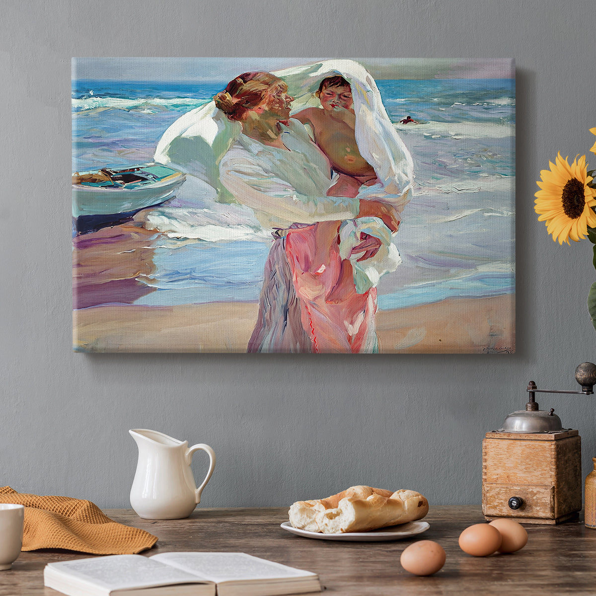 Canvas art print featuring figures standing on beach drying off after swimming in sunlight, set in a cozy kitchen setting