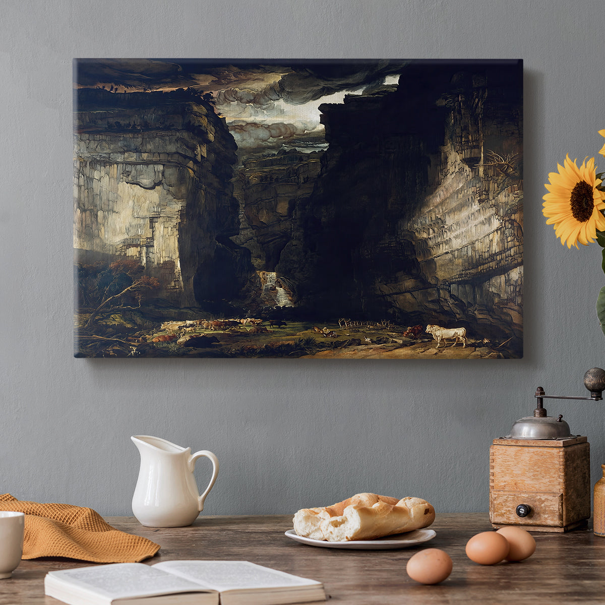 Canvas art print featuring a dramatic rocky gorge with towering cliffs and waterfall, set in a cozy kitchen setting