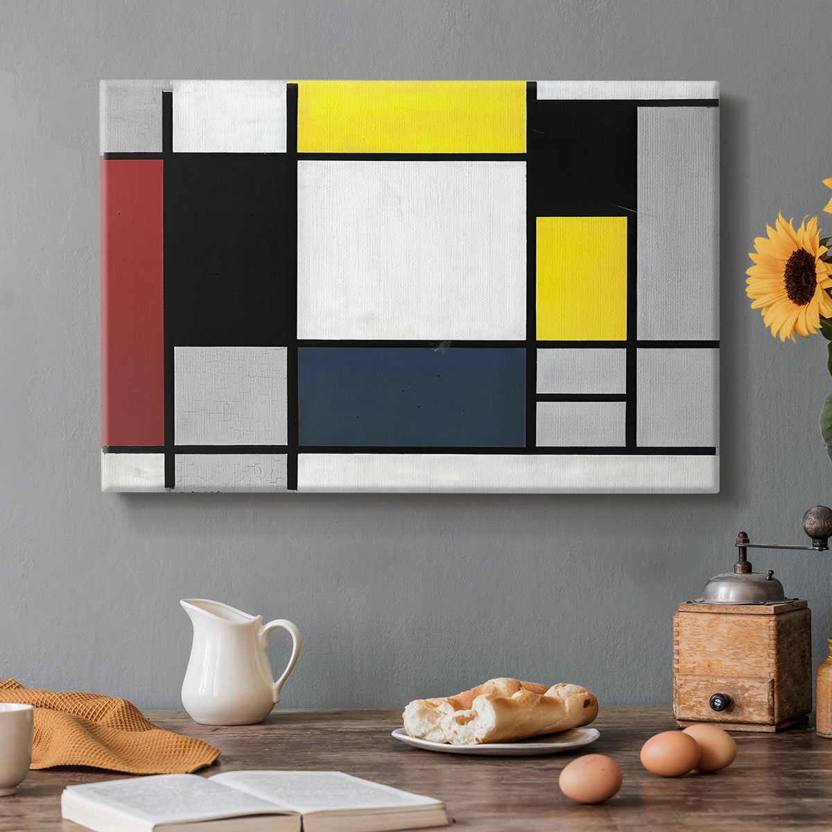 Canvas art print featuring a grid of rectangles with primary colors and black lines, set in a cozy kitchen setting