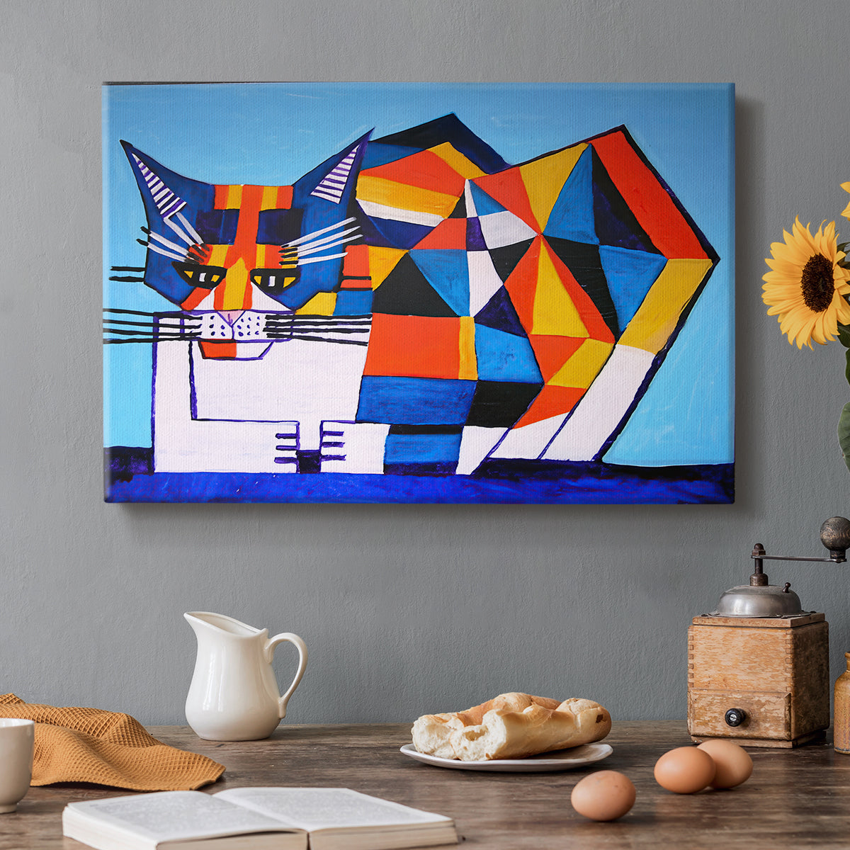 Canvas art print featuring a fragmented geometric figure composed of colorful shapes, set in a cozy kitchen setting