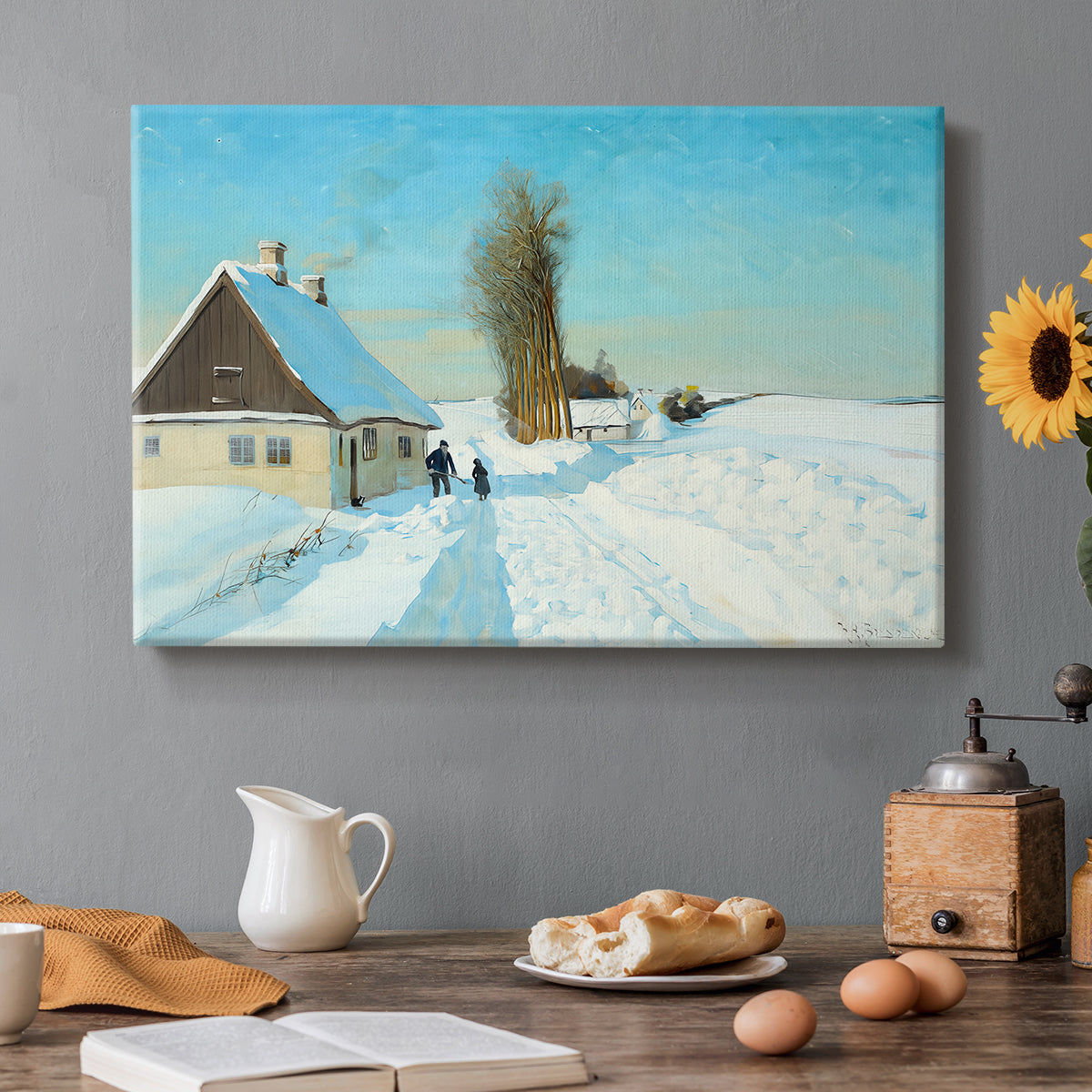 Canvas art print featuring a person shoveling snow outside house in bright winter landscape, set in a cozy kitchen setting