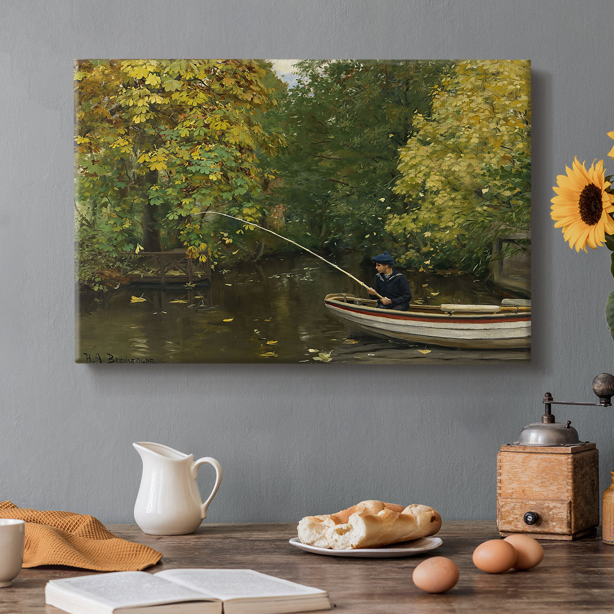Canvas art print featuring a young boy fishing beside calm water surrounded by greenery, set in a cozy kitchen setting