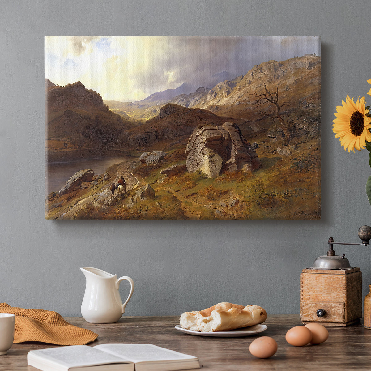 Canvas art print featuring an expansive valley landscape with river flowing through rugged hills, set in a cozy kitchen setting