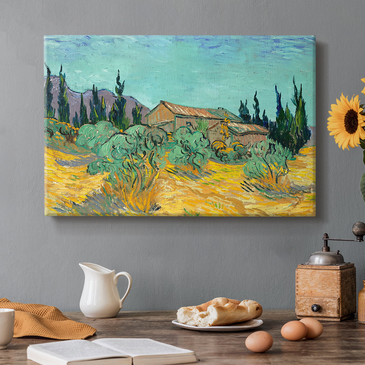 Canvas art print featuring rustic sheds surrounded by olive trees and tall cypresses in rural landscape, set in a cozy kitchen setting