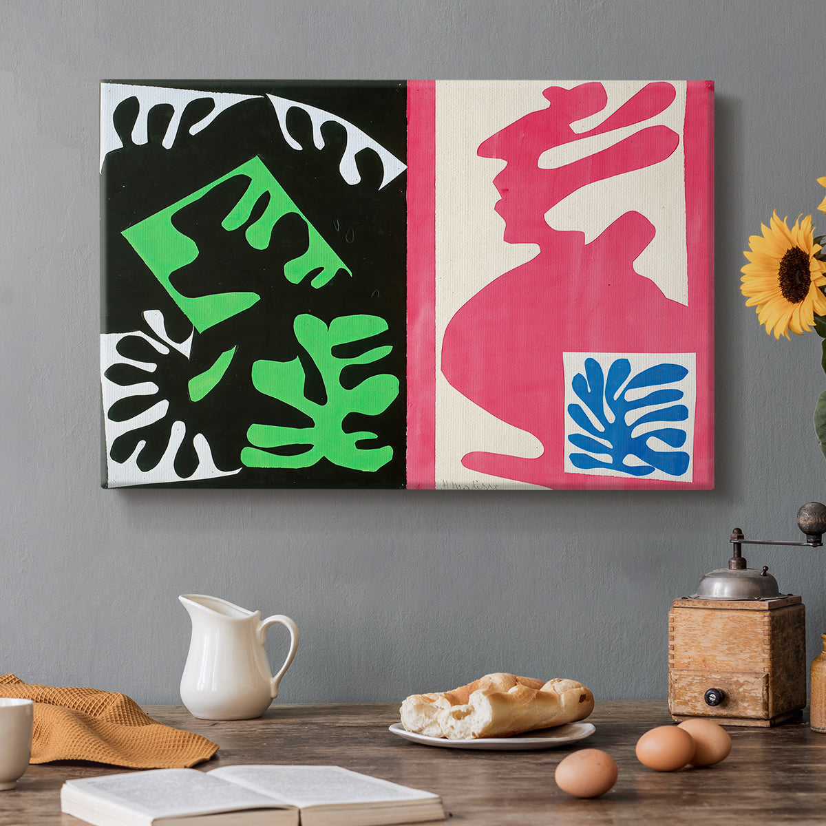 Canvas art print featuring an abstract collage of bold black and red shapes in dynamic arrangement, set in a cozy kitchen setting
