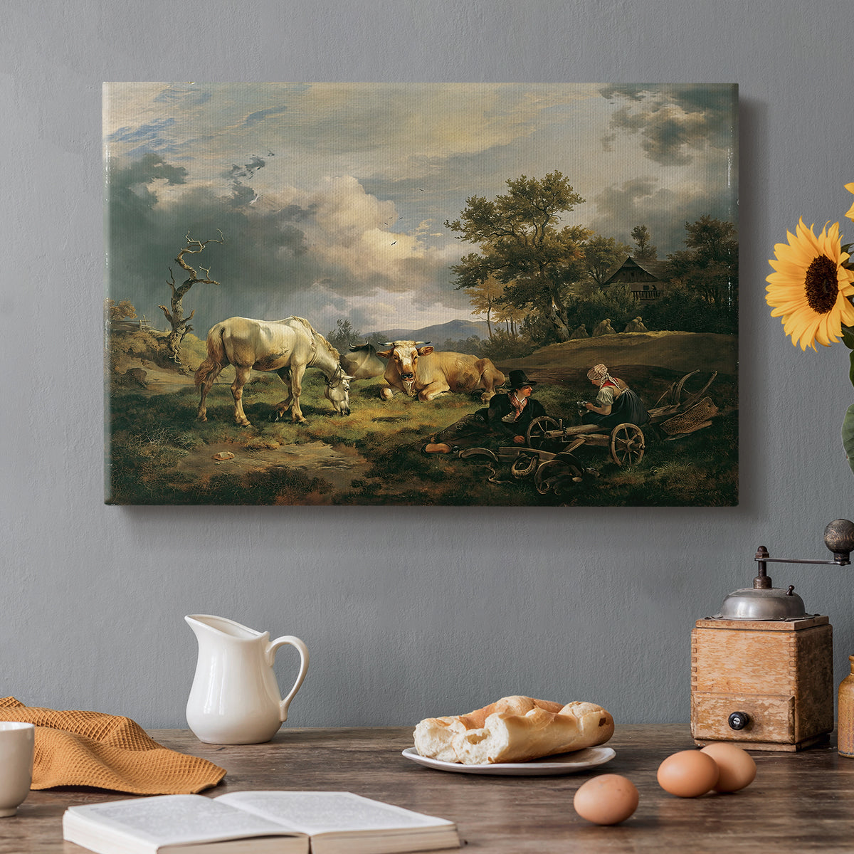 Canvas art print featuring a couple seated resting in open field, set in a cozy kitchen setting