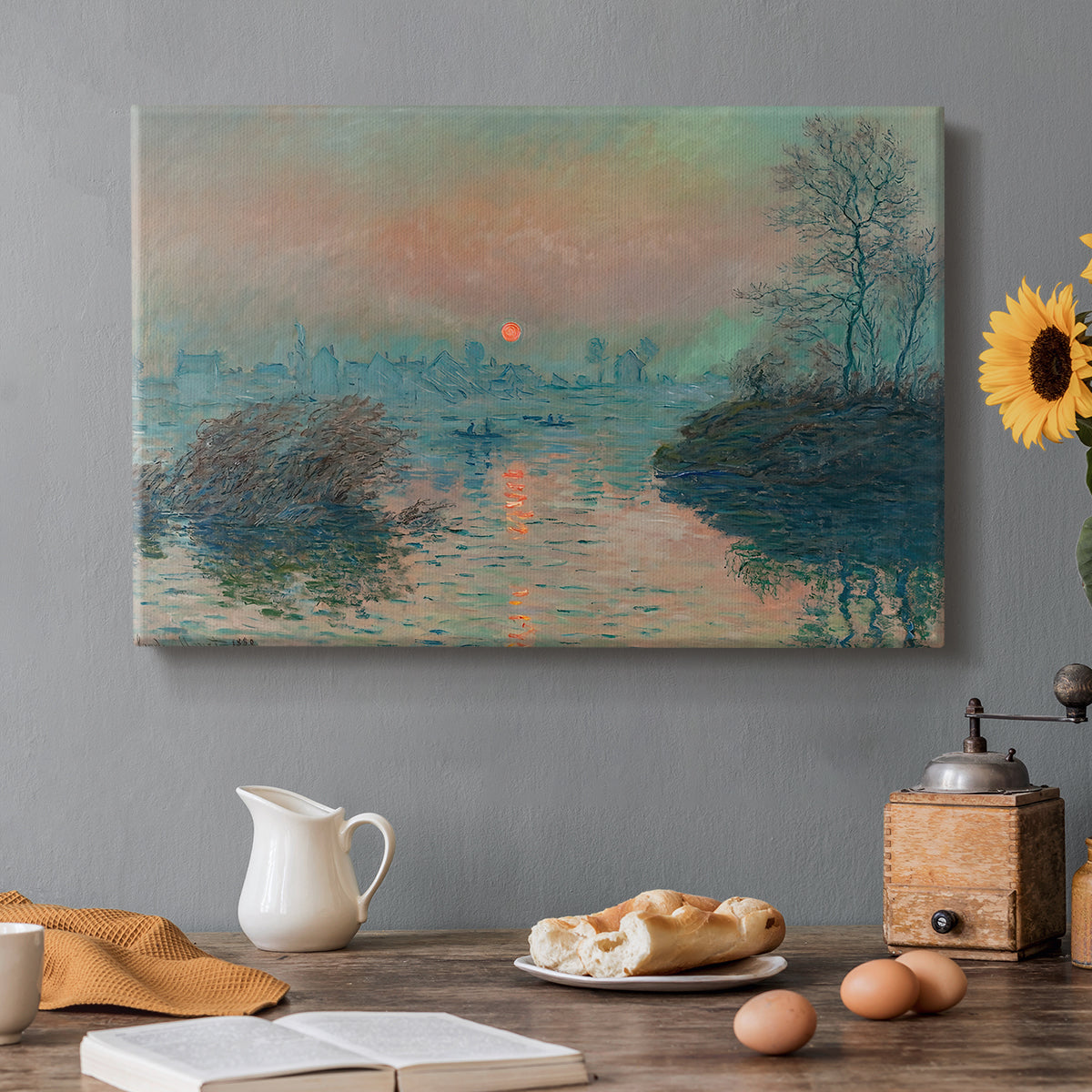 Canvas art print featuring a glowing sunset over snowy river landscape with soft reflections, set in a cozy kitchen setting