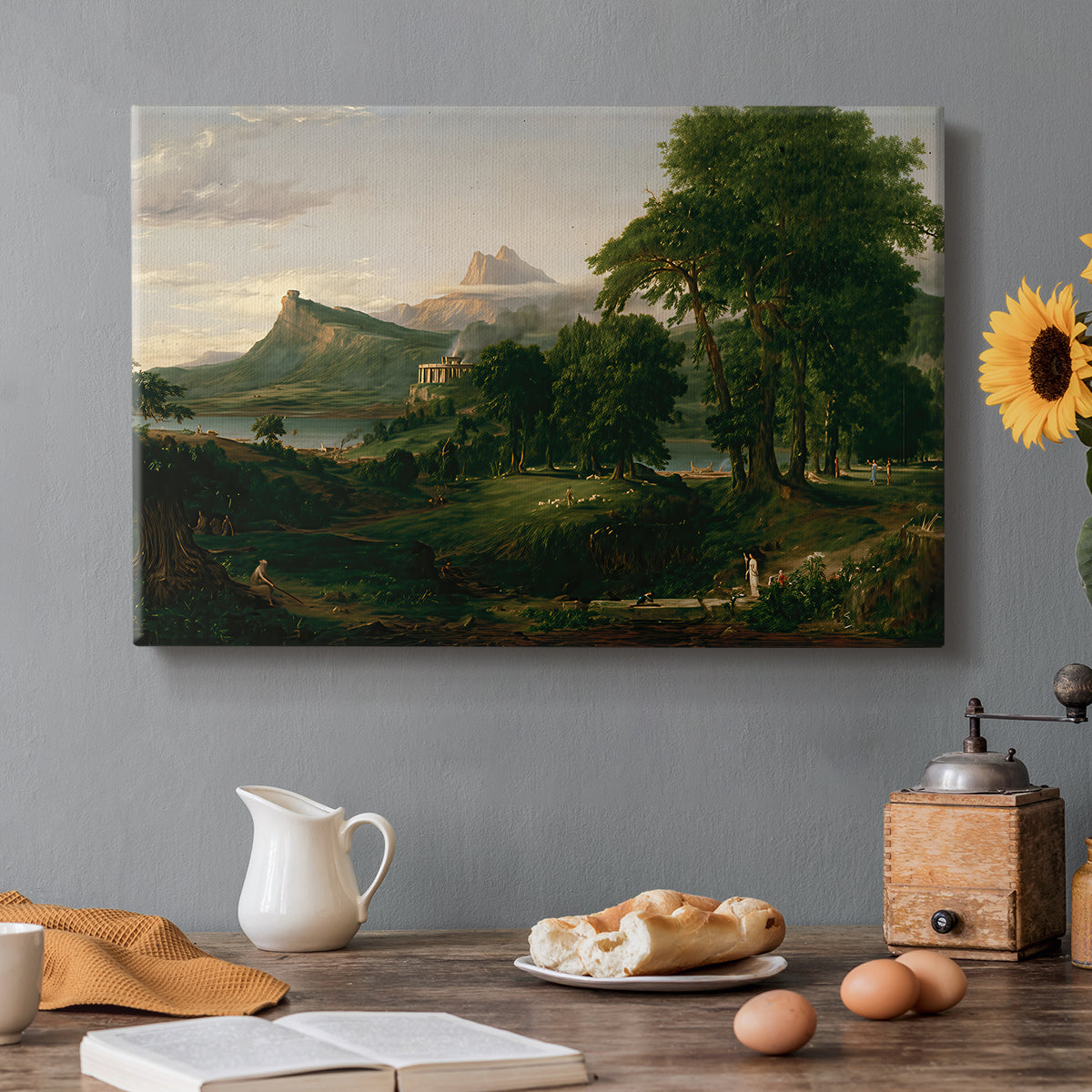 Canvas art print featuring a peaceful pastoral landscape with figures farming and grazing animals, set in a cozy kitchen setting
