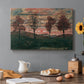 Canvas art print featuring four trees standing in open landscape against colorful sky, set in a cozy kitchen setting