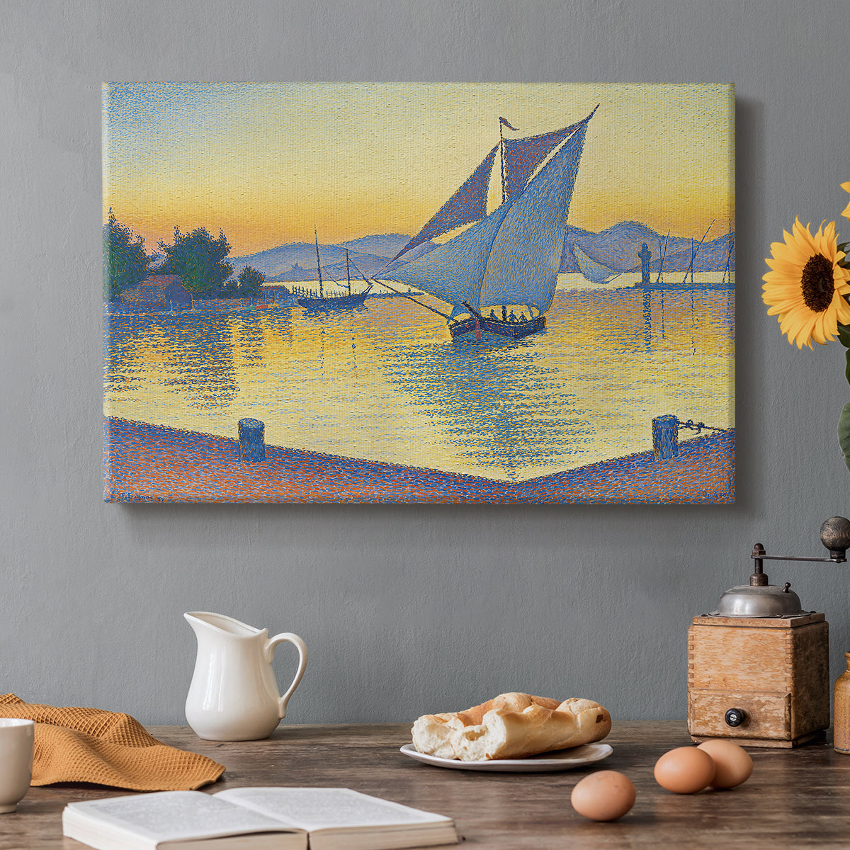 Canvas art print featuring a harbor glowing at sunset with boats in water, set in a cozy kitchen setting