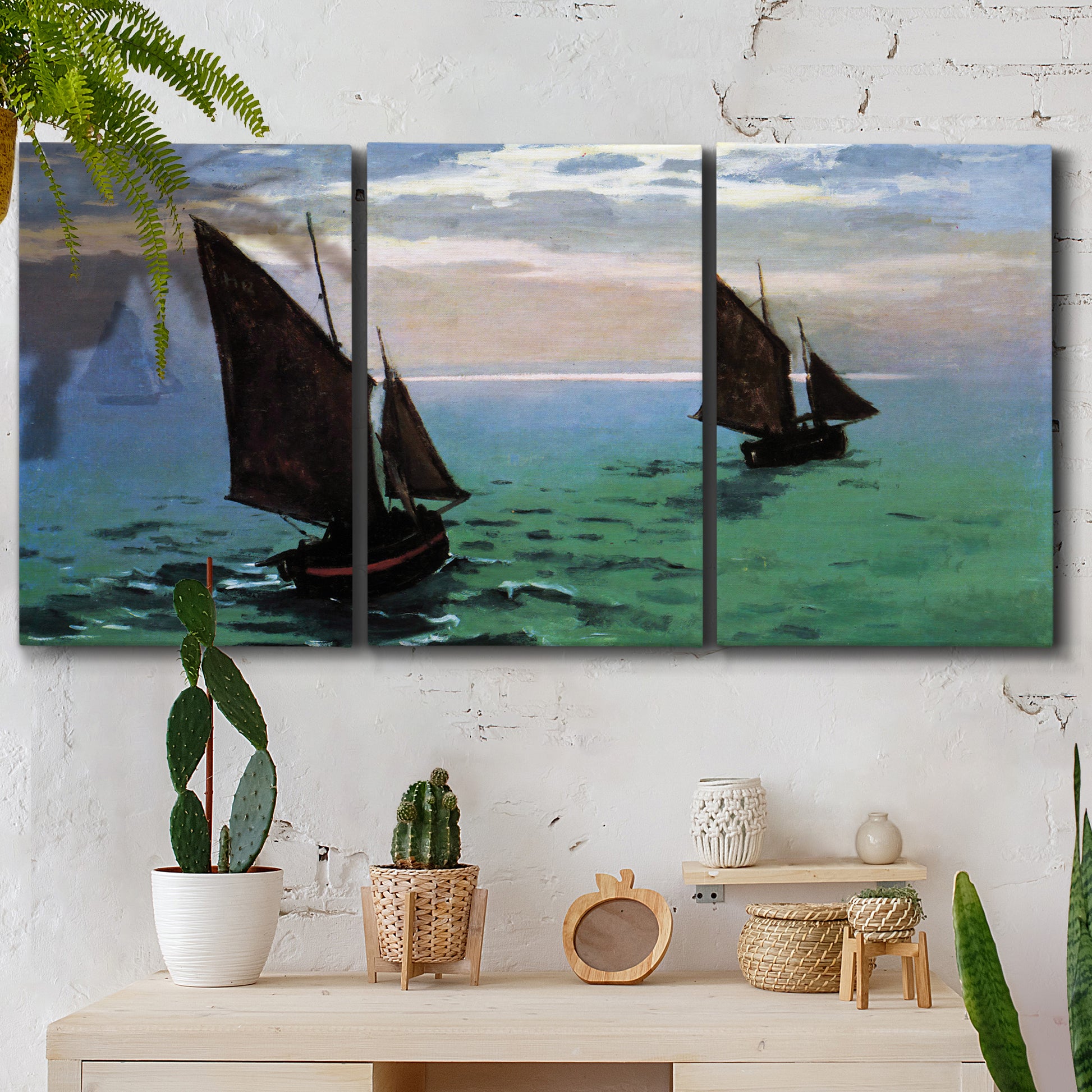 Three-panel canvas wall art featuring fishing boats moving through open sea, displayed in a boho-chic entryway above a console table.