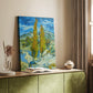 Canvas art print of a stylized nature scene with vertical trees and vivid tones styled in a home decor setting.