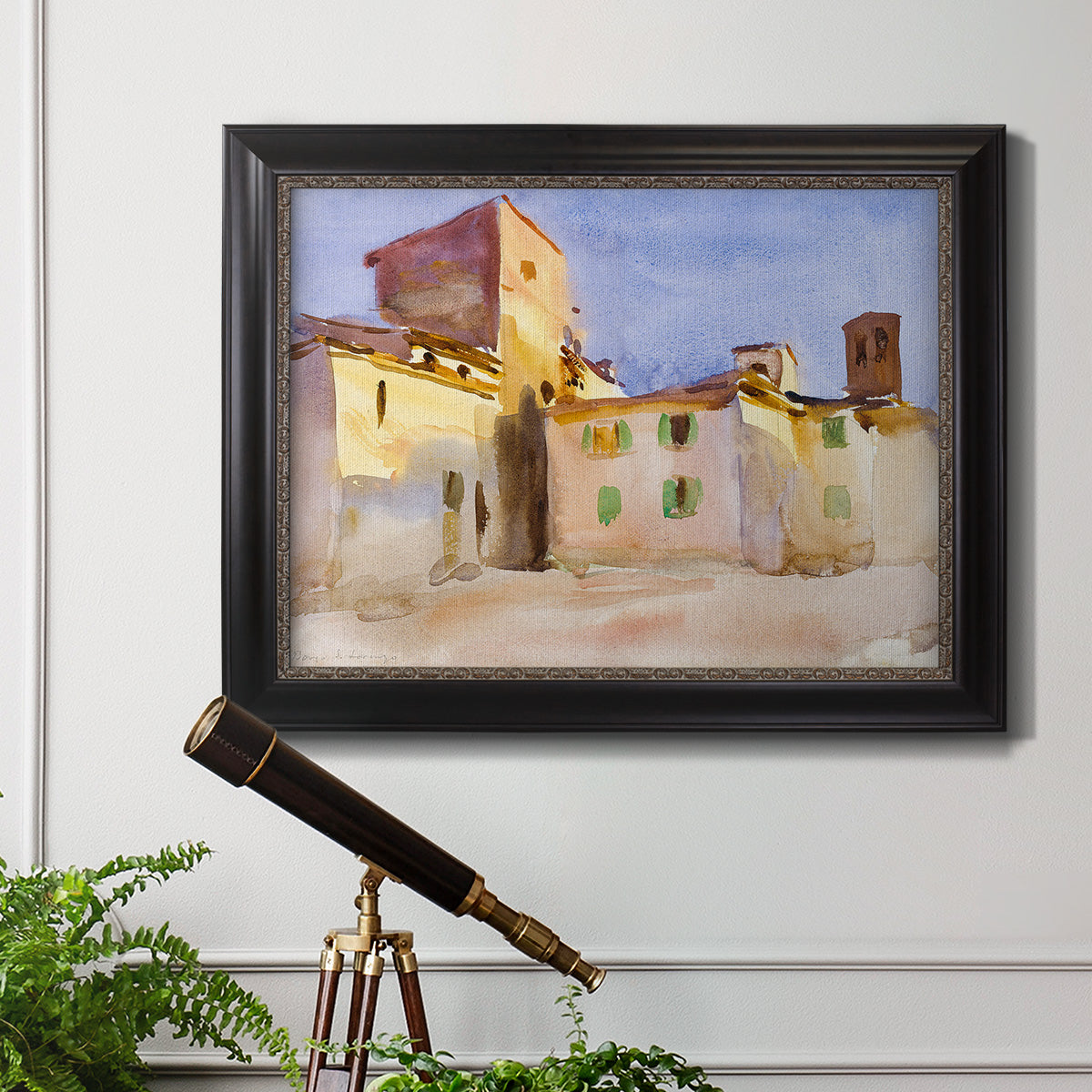 Impressionist Italian village scene by John Singer Sargent in an ornate black frame with gilded inner detail displayed in a light-toned interior setting.