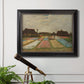 Impressionist Dutch bulb field landscape by Vincent van Gogh in an ornate black frame with gilded inner detail displayed in a light-toned interior setting.