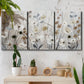 Three-panel canvas wall art featuring misty wildflower meadow landscape, displayed in a boho-chic entryway above a console table.
