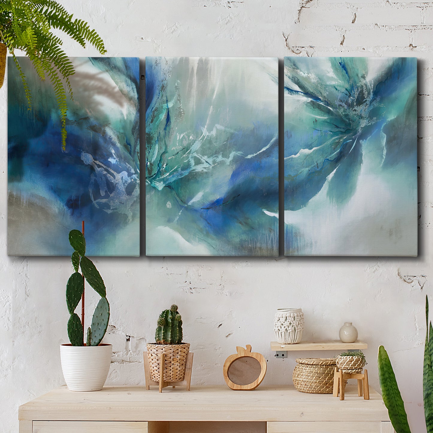 Three-panel canvas wall art featuring subtle abstract light flicker composition, displayed in a boho-chic entryway above a console table.