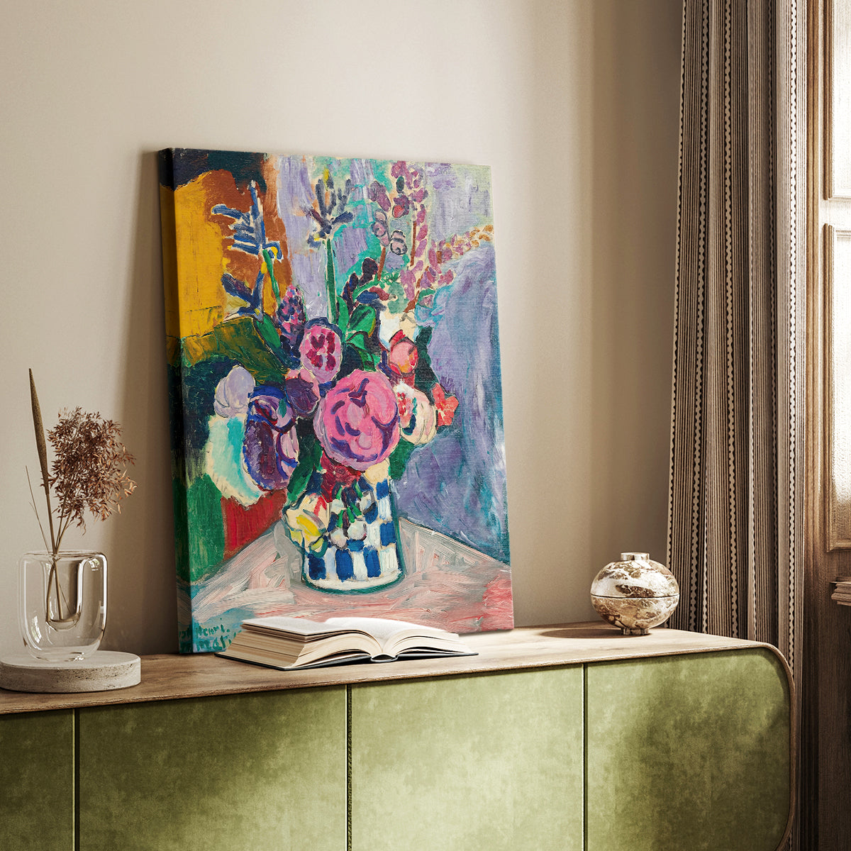 Canvas art print of a bright floral arrangement with layered petals and bold tones styled in a home decor setting.