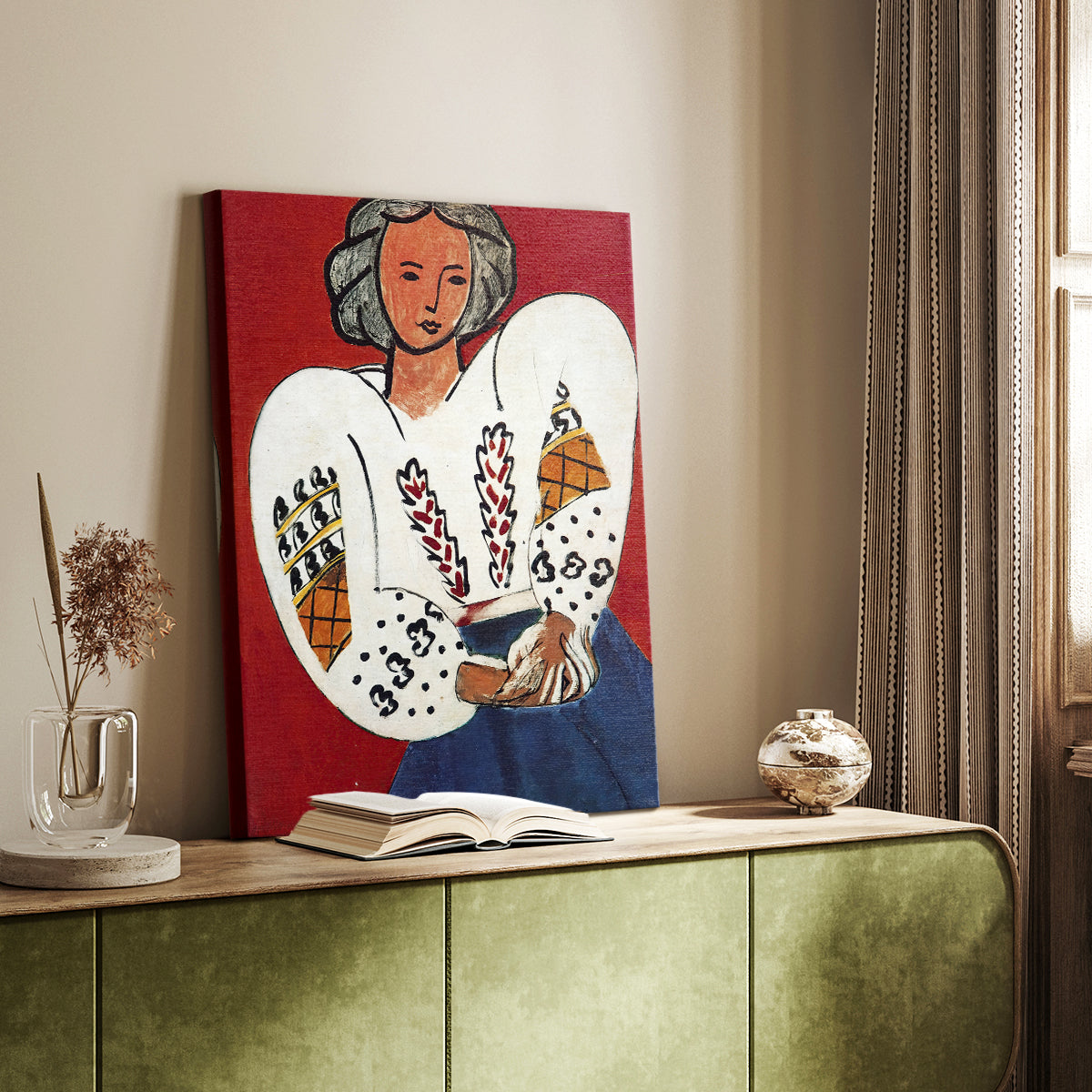 Canvas art print of a stylized figure with intricate textile design and vivid tones styled in a home decor setting.