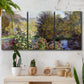 Three-panel canvas wall art featuring garden corner with flowering trees, displayed in a boho-chic entryway above a console table.