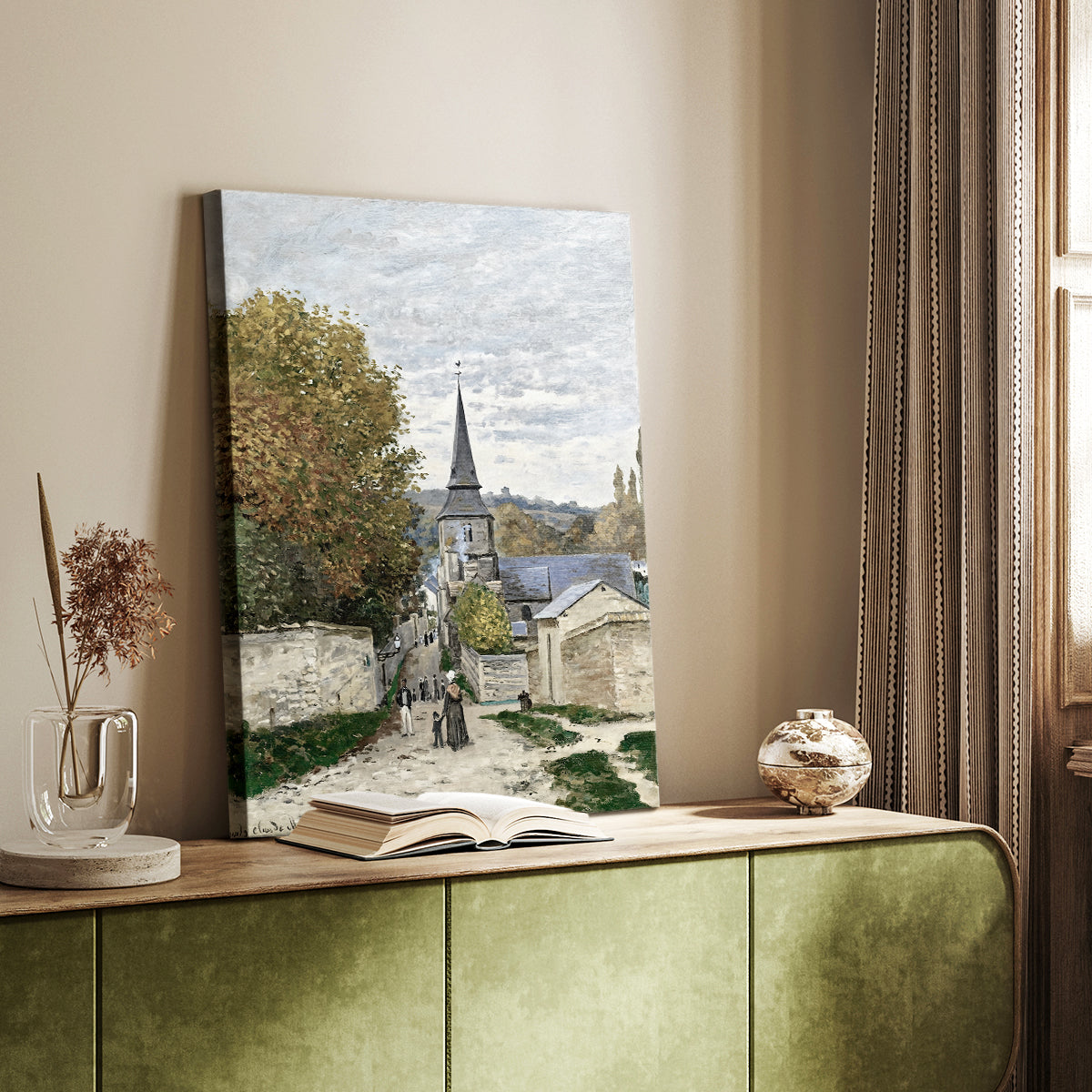 Canvas art print of a coastal town street with light tones and loose brushwork styled in a home decor setting.