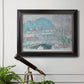 Impressionist coastal village landscape in Norway by Claude Monet in an ornate black frame with gilded inner detail displayed in a light-toned interior setting.