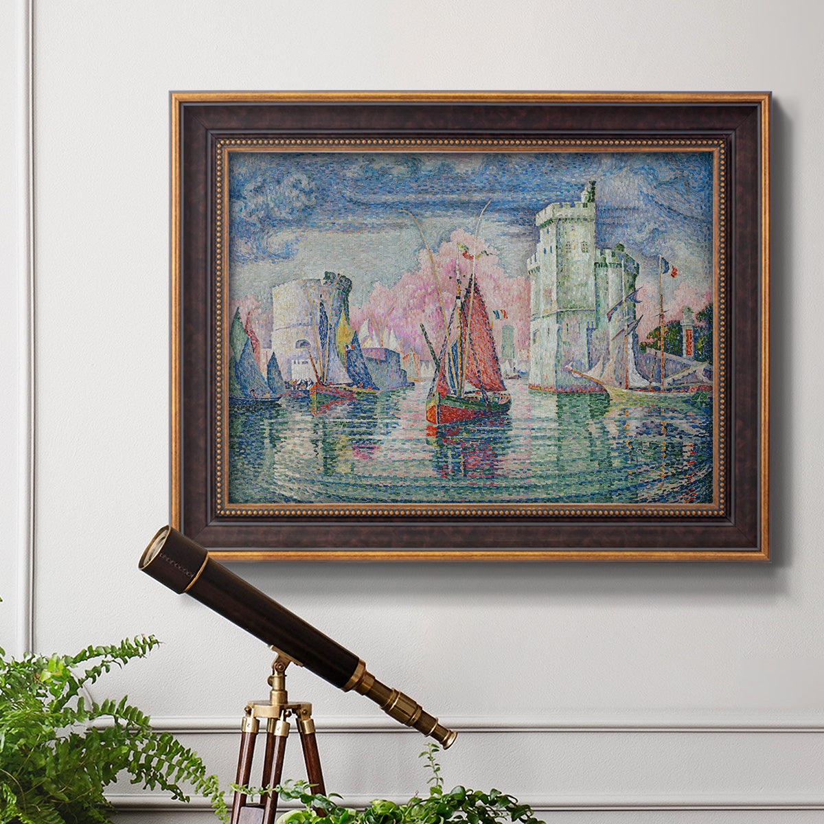 Impressionist harbor scene by Paul Signac in an ornate bronzed mahogany wood frame displayed in a light-toned interior setting.