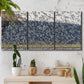 Three-panel canvas wall art featuring group of animals in open field, displayed in a boho-chic entryway above a console table.