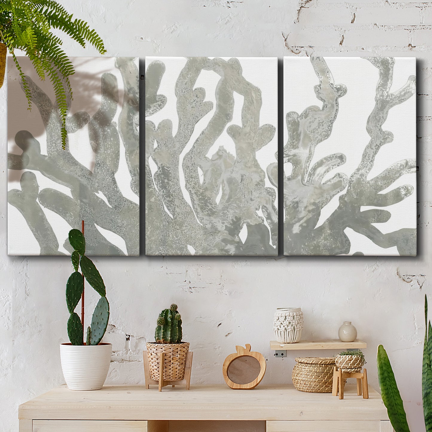 Three-panel canvas wall art featuring monochrome coral texture study, displayed in a boho-chic entryway above a console table.
