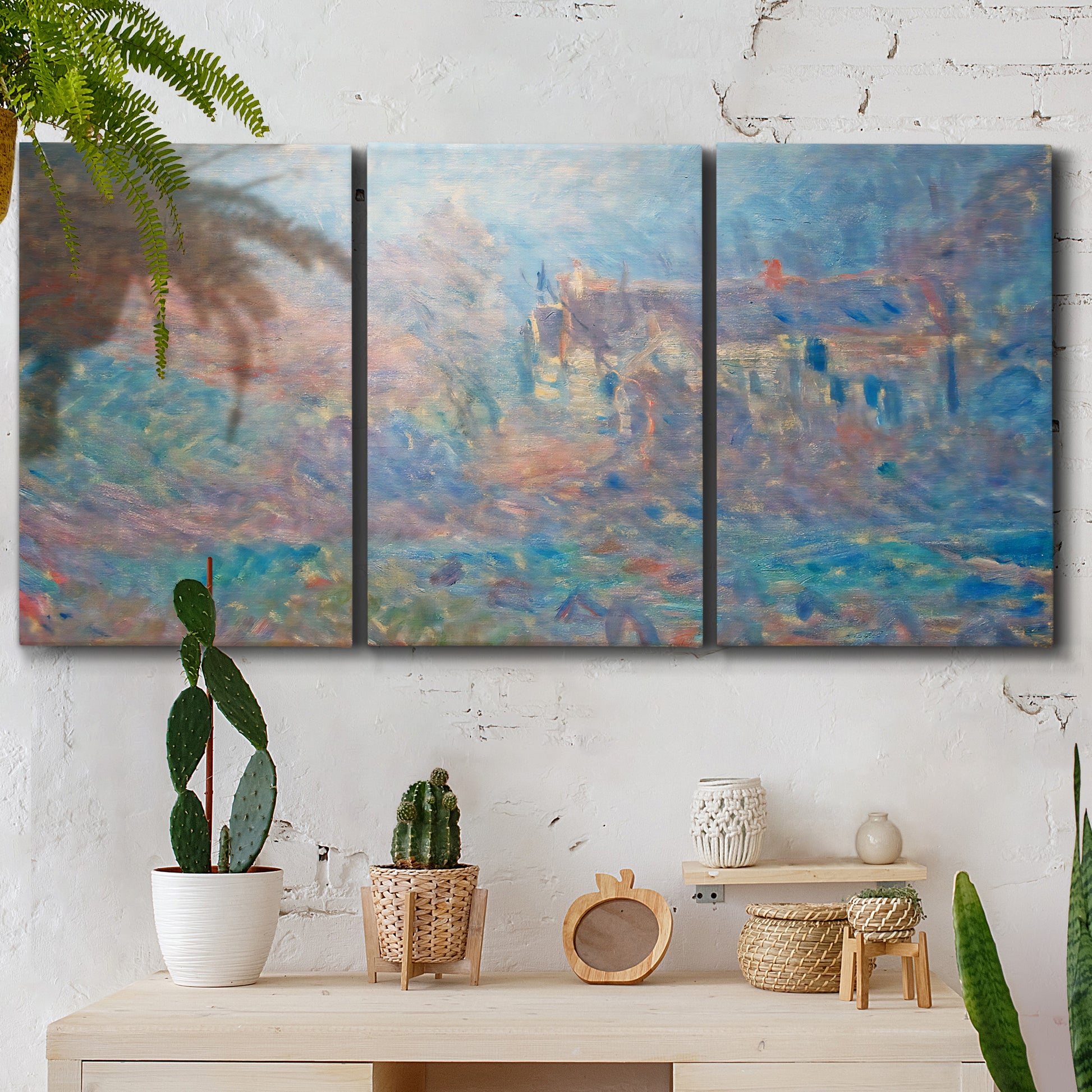 Three-panel canvas wall art featuring sunlit valley landscape, displayed in a boho-chic entryway above a console table.