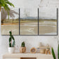 Three-panel canvas wall art featuring golden hour light over landscape, displayed in a boho-chic entryway above a console table.