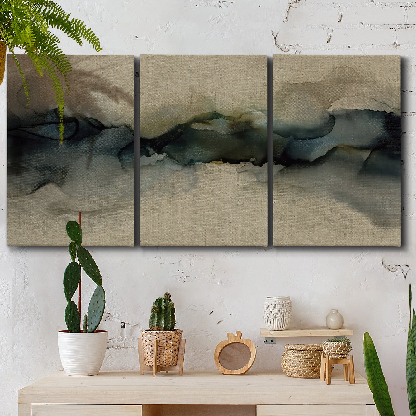 Three-panel canvas wall art featuring calm abstract water surface stillness, displayed in a boho-chic entryway above a console table.