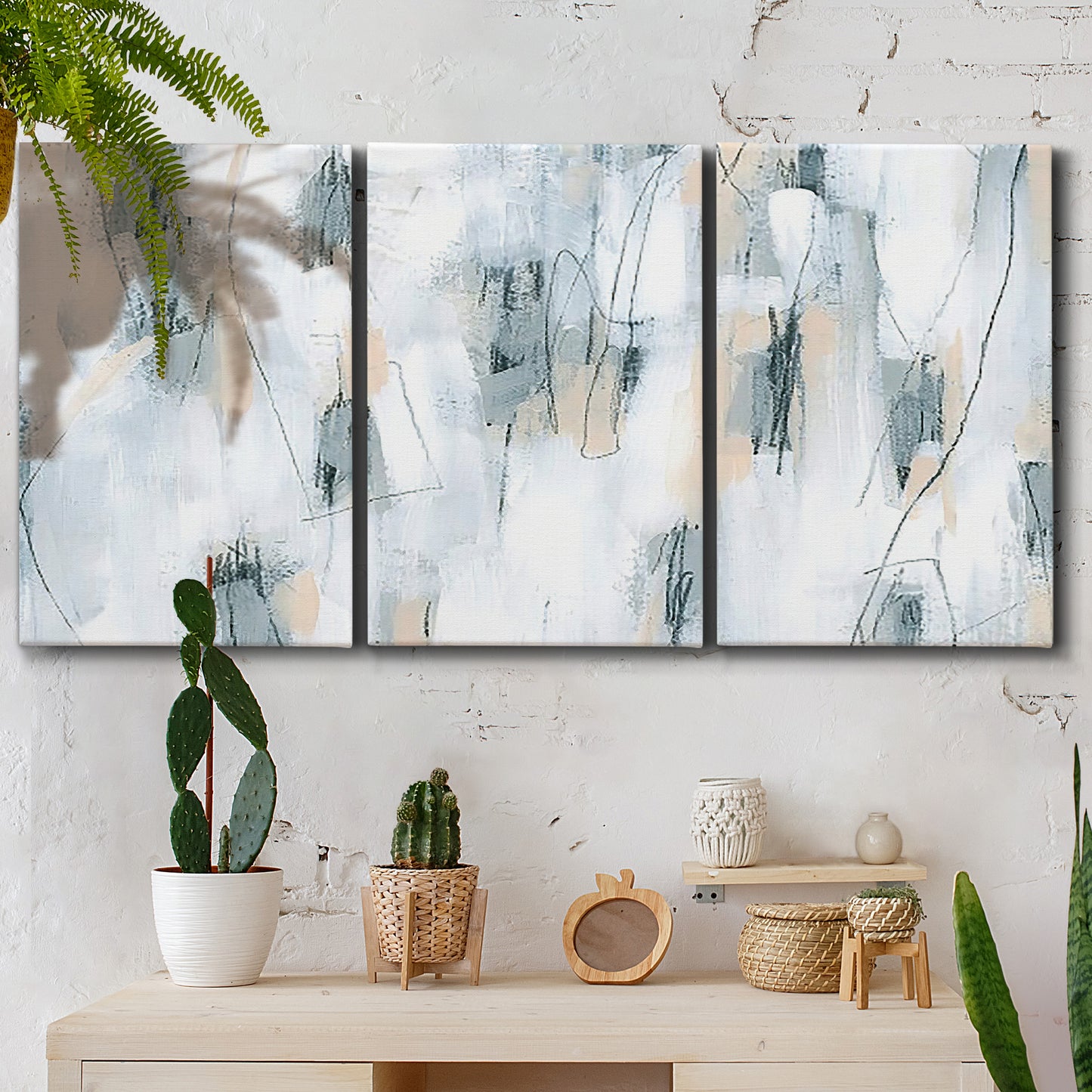 Three-panel canvas wall art featuring industrial textured abstract hatch patterns, displayed in a boho-chic entryway above a console table.