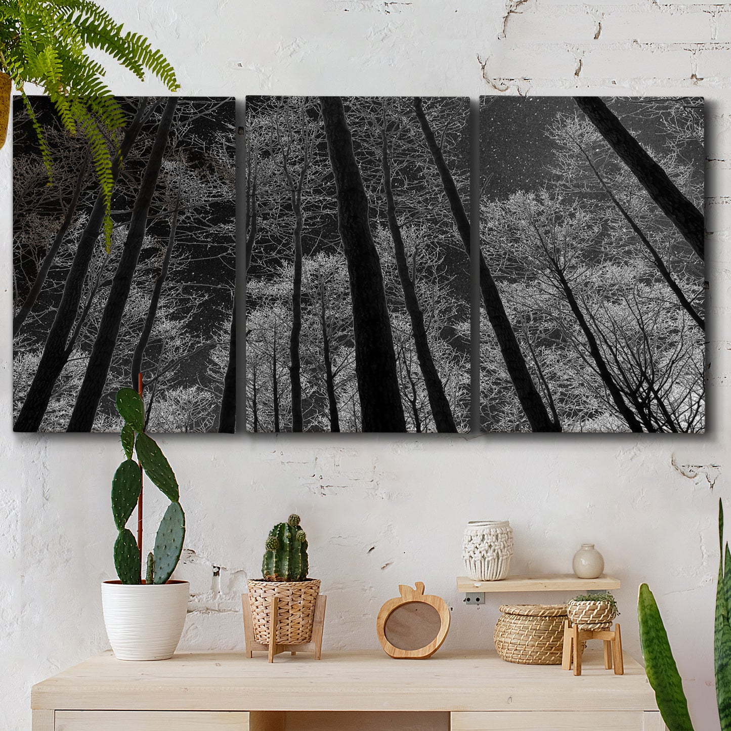 Three-panel canvas wall art featuring riverside houses along canal, displayed in a boho-chic entryway above a console table.