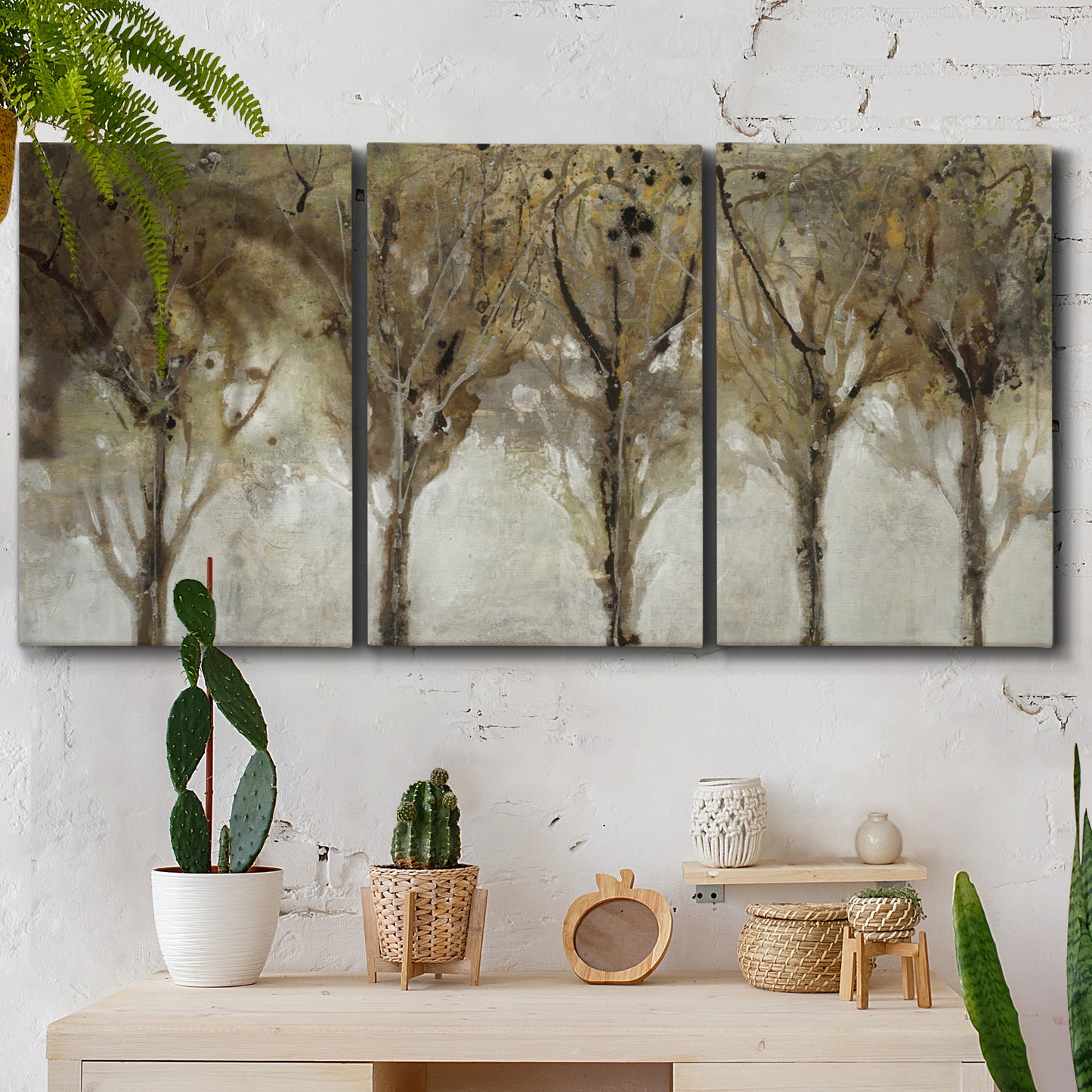 Three-panel canvas wall art featuring sunlight filtering through trees, displayed in a boho-chic entryway above a console table.