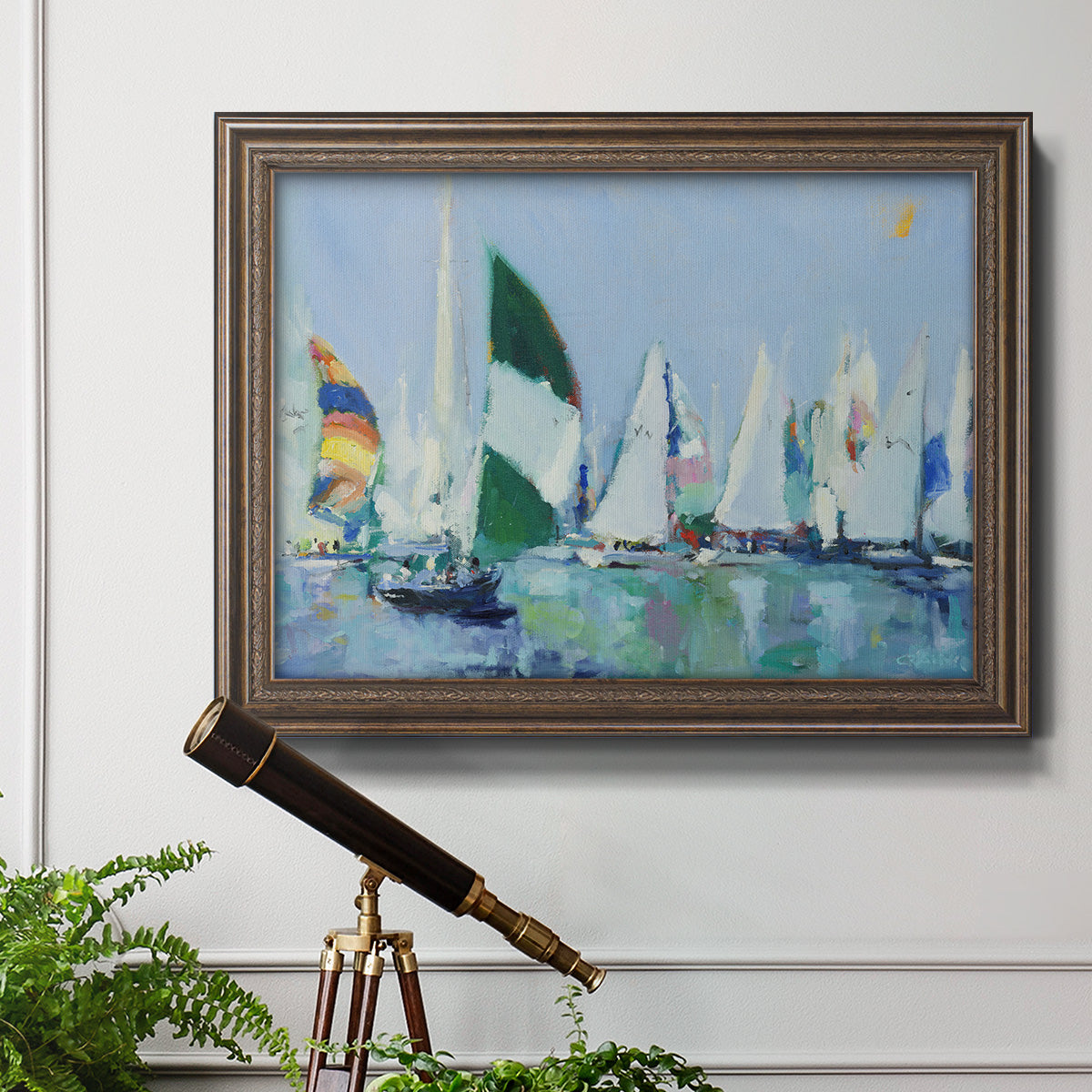 Coastal harbor watercolor painting in an ornate traditional bronze frame displayed in a light-toned interior setting.