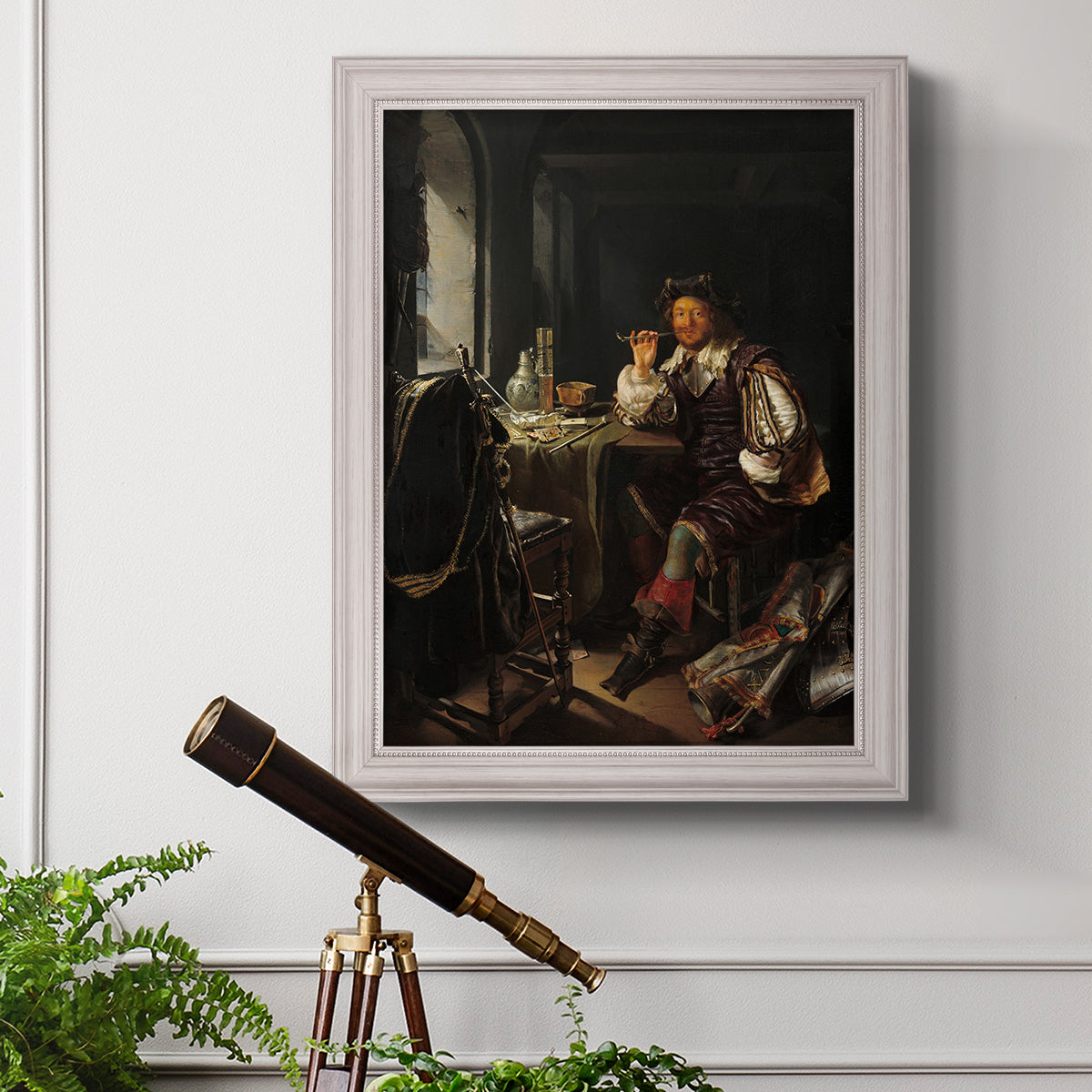Classical portrait of a soldier smoking a pipe by Frans van Mieris the Elder in an ornate weathered white frame displayed in a light-toned interior setting.