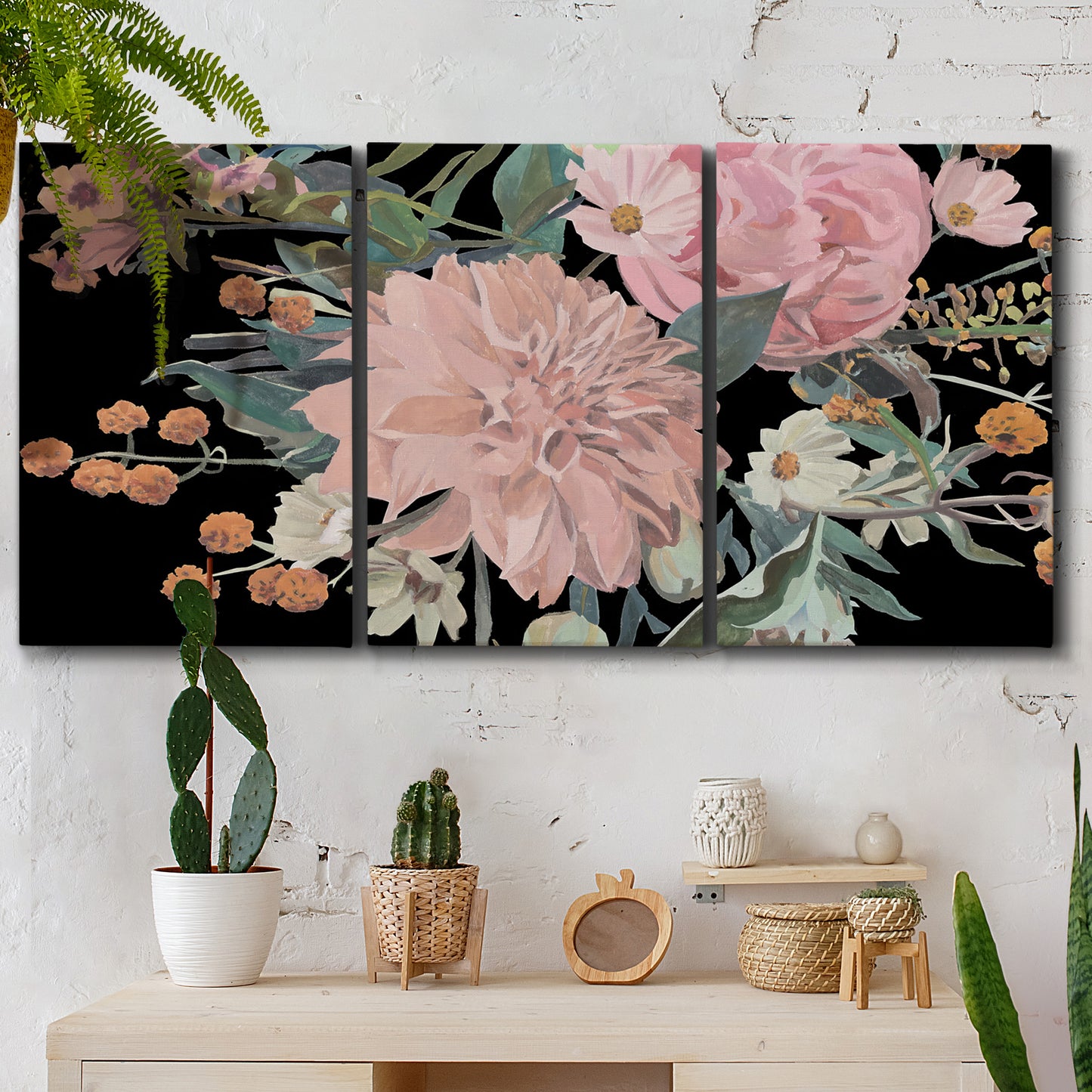 Three-panel canvas wall art featuring dark floral night blossoms, displayed in a boho-chic entryway above a console table.