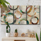 Three-panel canvas wall art featuring geometric circular abstract design, displayed in a boho-chic entryway above a console table.