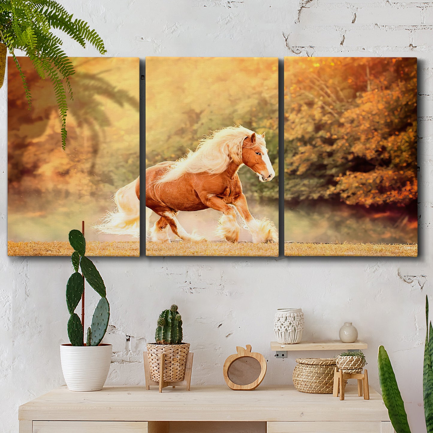 Three-panel canvas wall art featuring running horses captured in motion, displayed in a boho-chic entryway above a console table.
