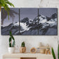 Three-panel canvas wall art featuring moonlit mountain peaks under night sky, displayed in a boho-chic entryway above a console table.