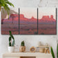 Three-panel canvas wall art featuring red rock desert formations at dusk, displayed in a boho-chic entryway above a console table.