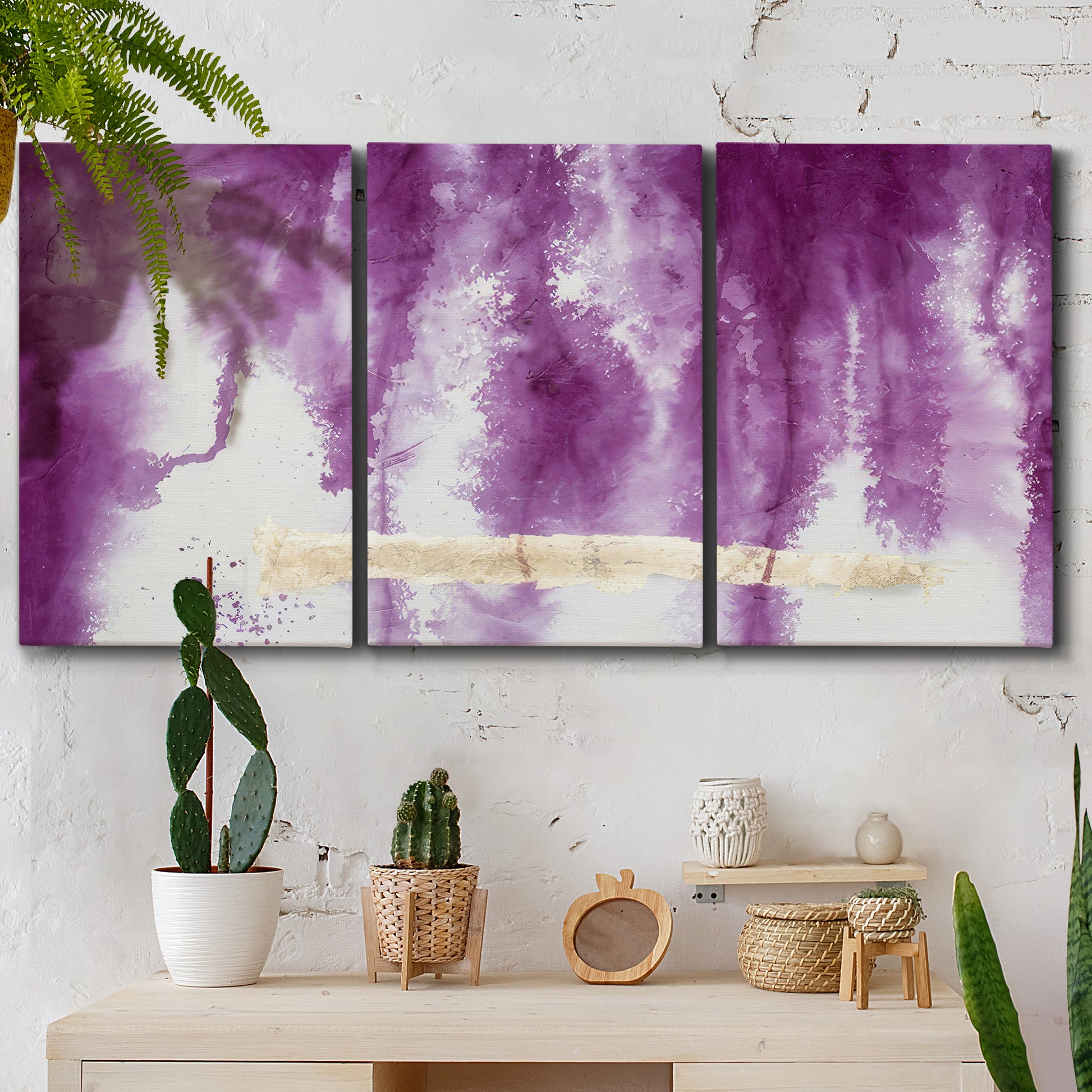 Three-panel canvas wall art featuring saturated abstract color fields, displayed in a boho-chic entryway above a console table.