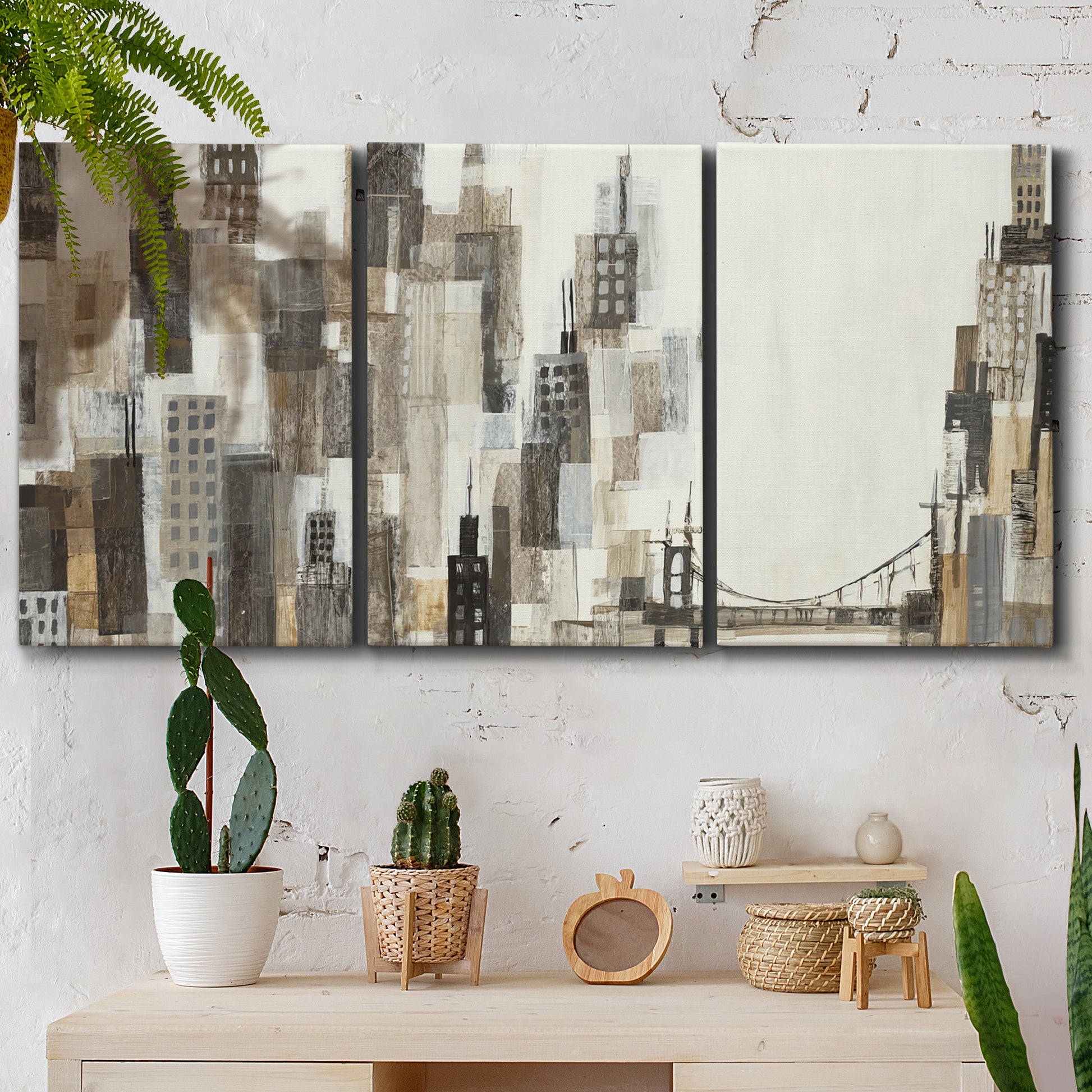 Three-panel canvas wall art featuring abstract harbor inspired composition, displayed in a boho-chic entryway above a console table.