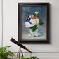 Impressionist floral still life painting by Claude Monet in an ornate black frame with gilded inner detail displayed in a light-toned interior setting.