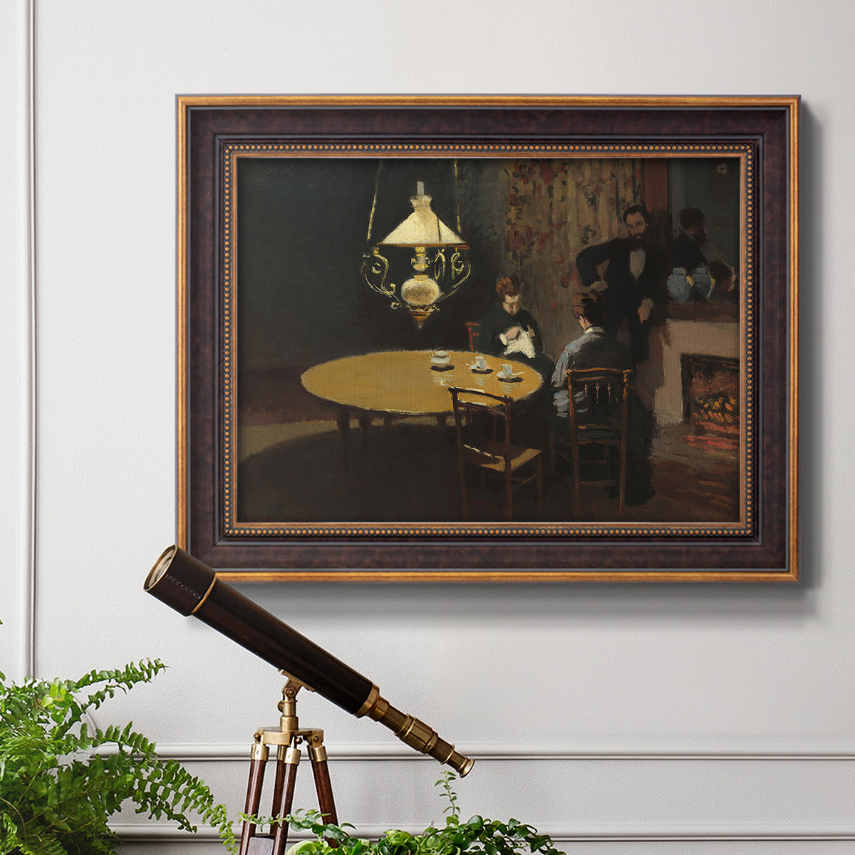 Impressionist domestic interior scene by Claude Monet in an ornate bronzed mahogany wood frame displayed in a light-toned interior setting.