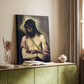 Canvas art print of a spiritual figure with gentle tones and dark background styled in a home decor setting.