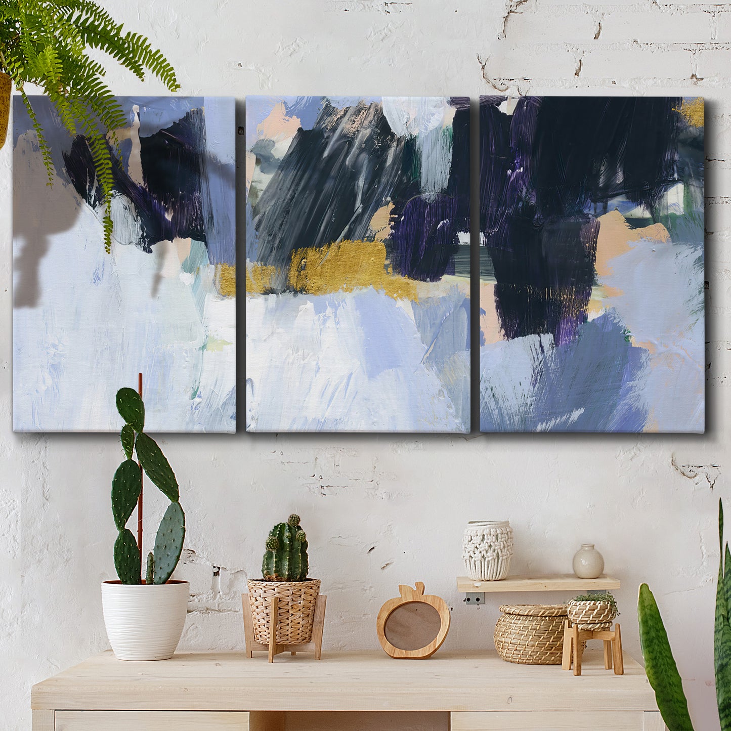 Three-panel canvas wall art featuring icy abstract arctic ledge, displayed in a boho-chic entryway above a console table.