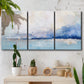 Three-panel canvas wall art featuring abstract bay with rhythmic forms, displayed in a boho-chic entryway above a console table.