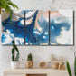 Three-panel canvas wall art featuring flowing blue abstract movement, displayed in a boho-chic entryway above a console table.
